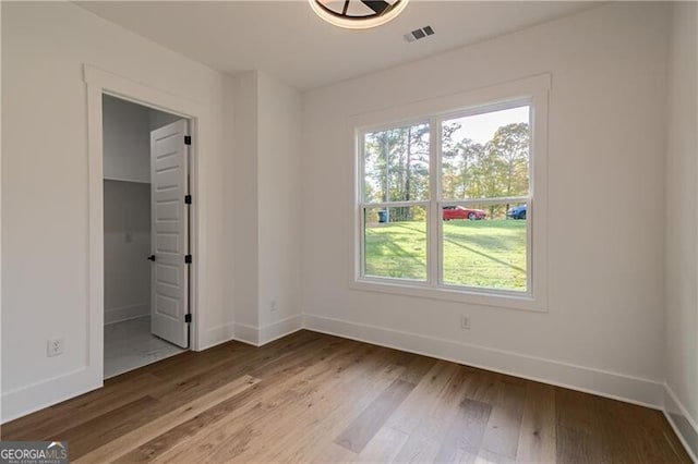 2861 Tree Top Rd, Dacula, GA 30019 - unfurnished bedroom with baseboards and multiple windows