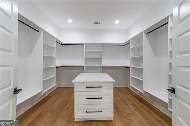 2861 Tree Top Rd, Dacula, GA 30019 - spacious closet featuring light wood-style floors