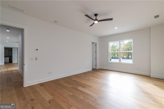 2861 Tree Top Rd, Dacula, GA 30019 - empty room with a ceiling fan, wood finished floors, baseboards, and recessed lighting