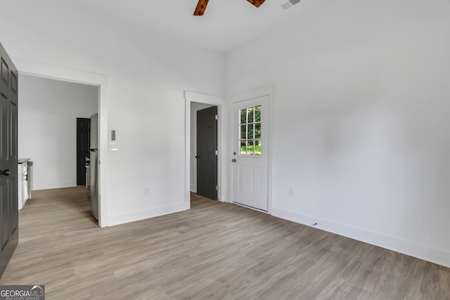 spare room with light hardwood / wood-style floors and ceiling fan