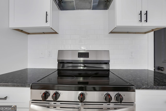 kitchen featuring exhaust hood, white cabinets, stainless steel stove, and tasteful backsplash