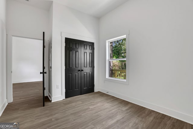 interior space with a closet and hardwood / wood-style floors