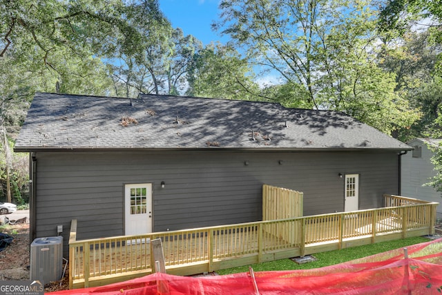 back of property featuring a wooden deck and central AC