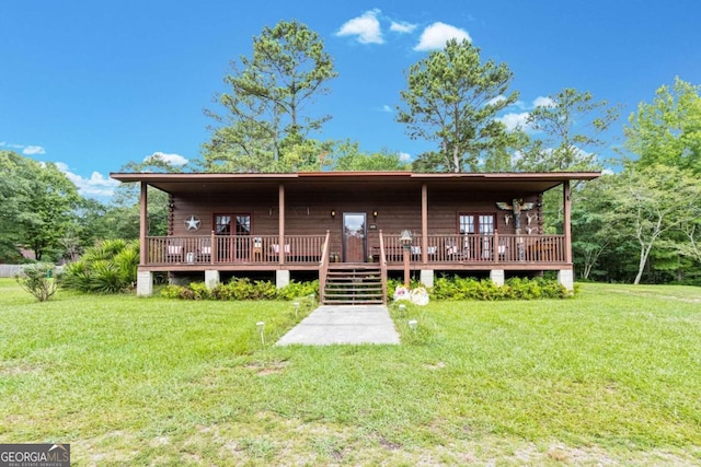 back of house with a wooden deck and a yard