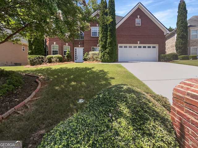 front facade featuring a garage and a front yard