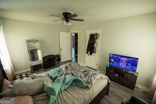 bedroom featuring ceiling fan and hardwood / wood-style flooring