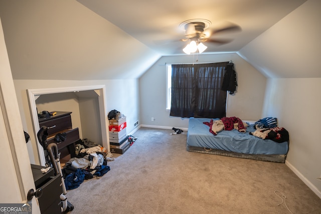 bedroom with carpet, lofted ceiling, and ceiling fan