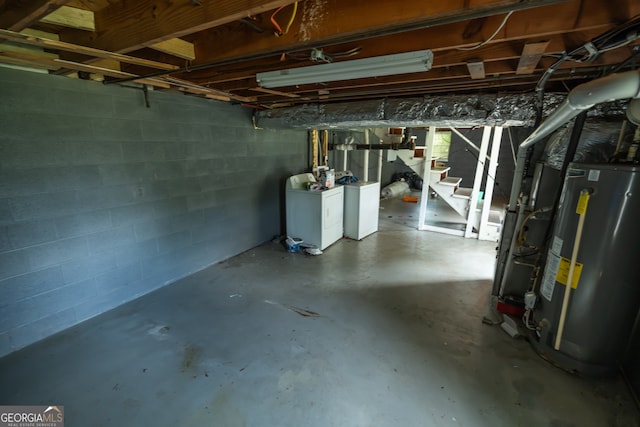 basement with washer and dryer and gas water heater