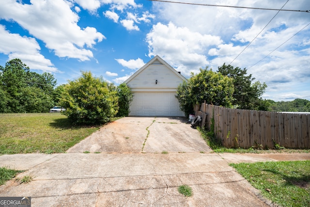 exterior space featuring a garage and a front yard