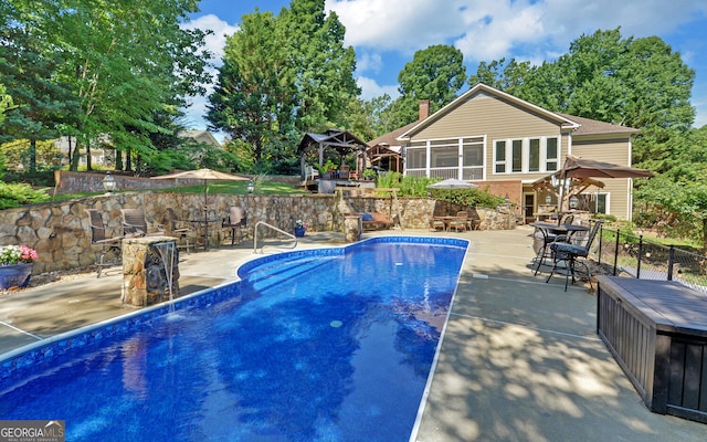 view of pool with a patio area and a gazebo