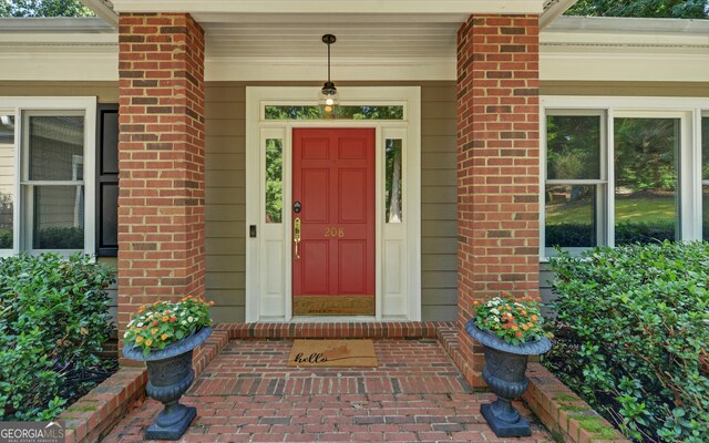 doorway to property featuring a porch