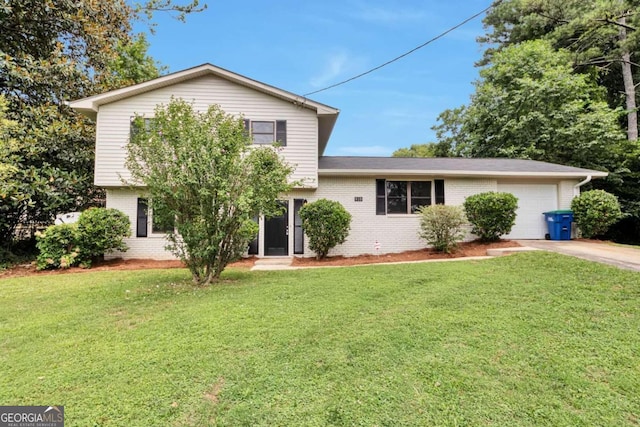 split level home featuring a garage and a front lawn