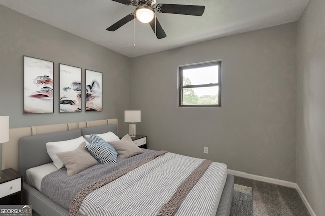 bedroom featuring ceiling fan and carpet