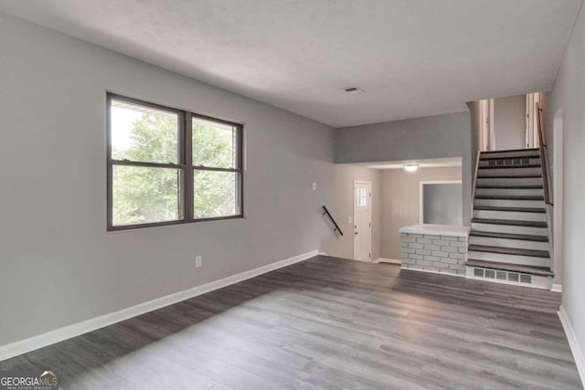 empty room featuring hardwood / wood-style flooring