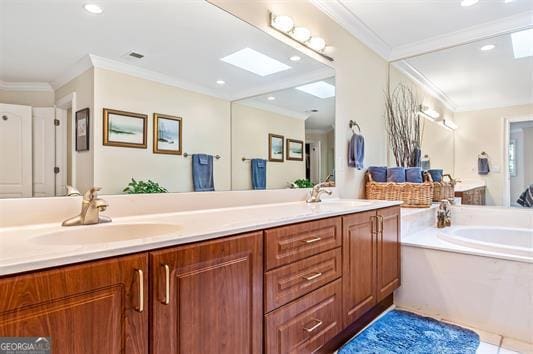 bathroom featuring a skylight, ornamental molding, double sink vanity, and a bath