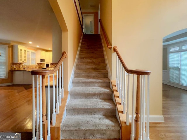 staircase featuring light hardwood / wood-style flooring