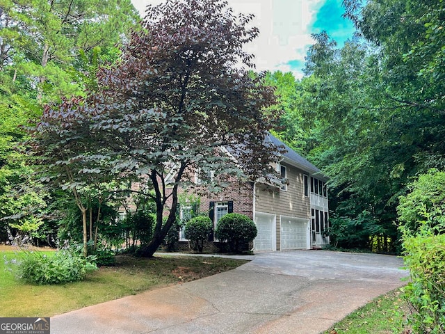 view of side of home featuring a garage