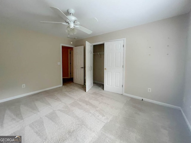 unfurnished bedroom with a closet, ceiling fan, and light colored carpet