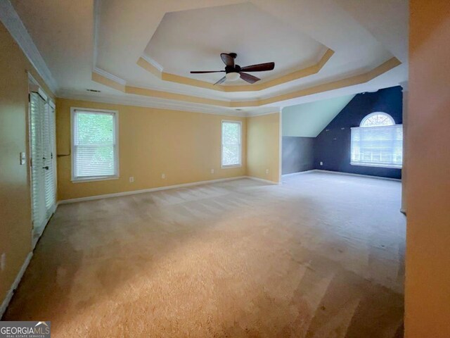 interior space with carpet floors and ceiling fan