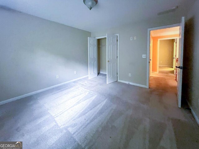 unfurnished bedroom with carpet floors