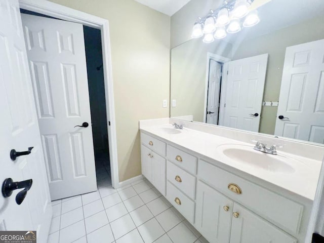 bathroom with double vanity and tile patterned floors