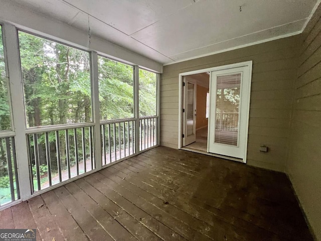 unfurnished sunroom featuring a healthy amount of sunlight