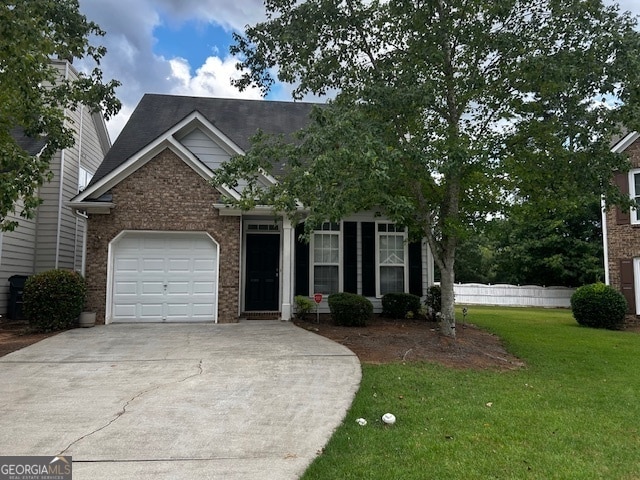 view of front of house featuring a garage and a front yard