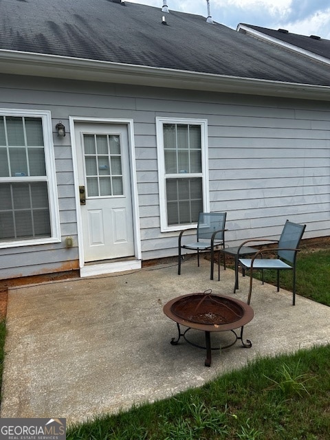 view of patio / terrace with an outdoor fire pit