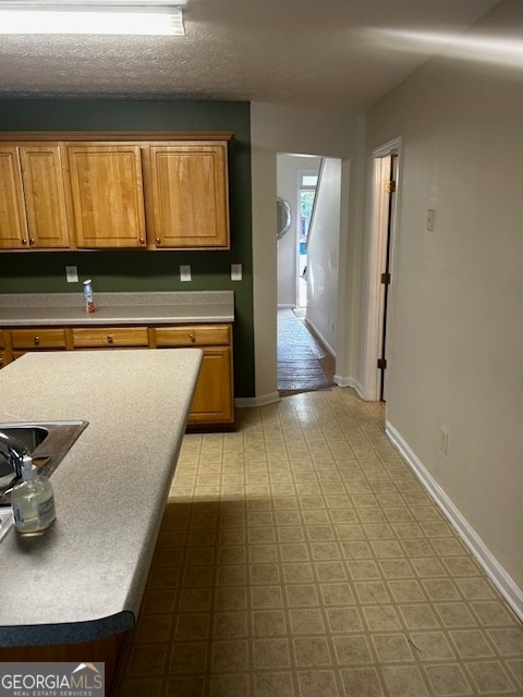 kitchen with light tile patterned floors