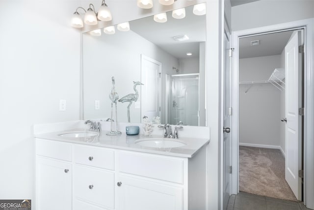 bathroom with vanity, tile patterned floors, and a shower with shower door