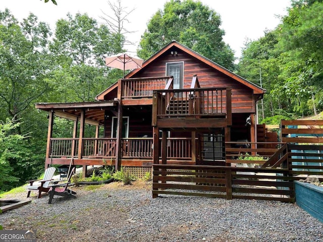 view of front of property featuring a wooden deck