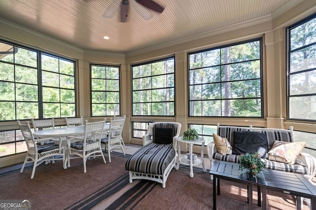 sunroom / solarium with ceiling fan and plenty of natural light