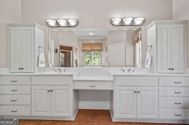 bathroom with dual vanity, tile patterned floors, and ornamental molding