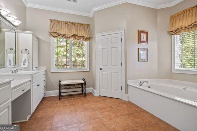 bathroom with tile patterned flooring, a tub to relax in, vanity, and ornamental molding