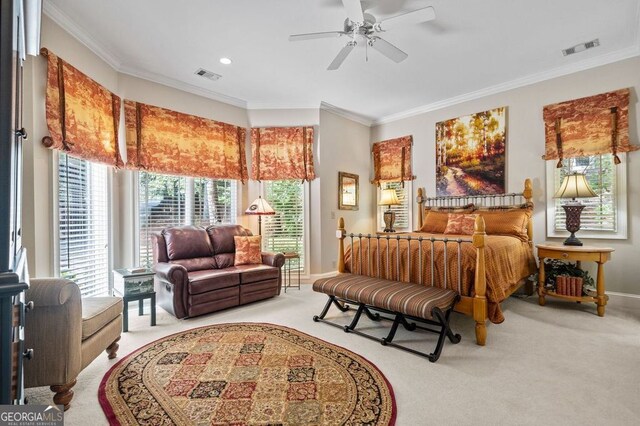 bedroom with ceiling fan, light colored carpet, and ornamental molding