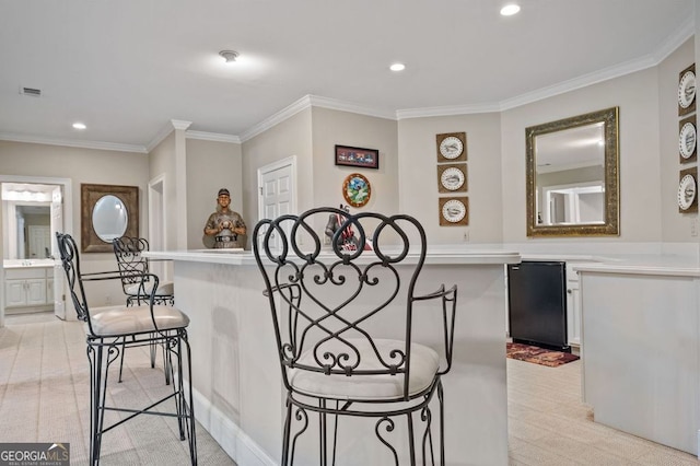 hallway featuring crown molding and light colored carpet