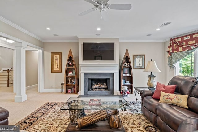 living room with light hardwood / wood-style floors, ornate columns, crown molding, and ceiling fan