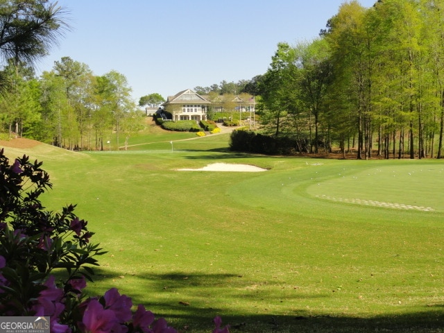 surrounding community featuring a lawn