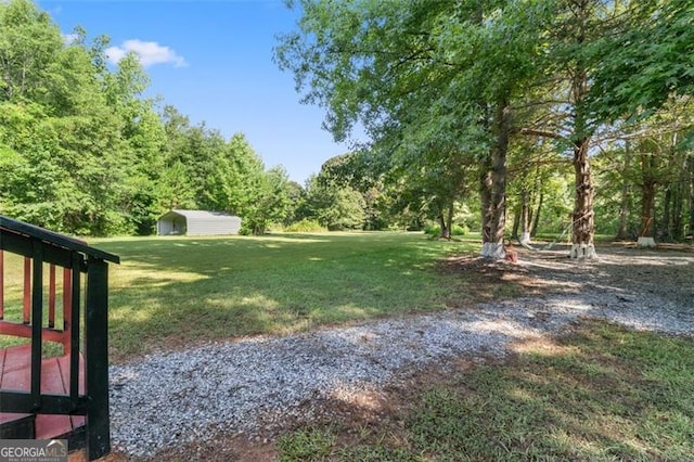 view of yard with a shed and an outdoor structure