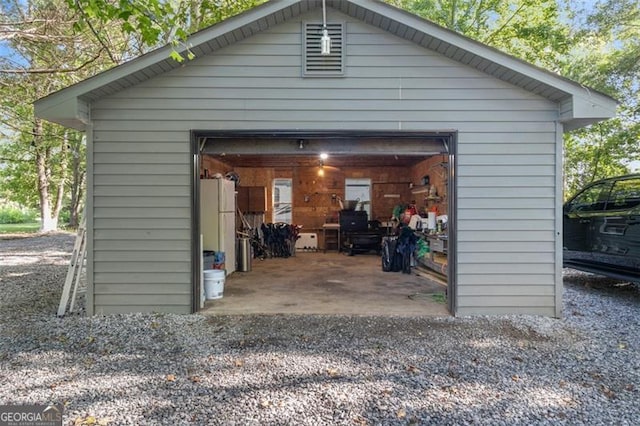 detached garage featuring freestanding refrigerator