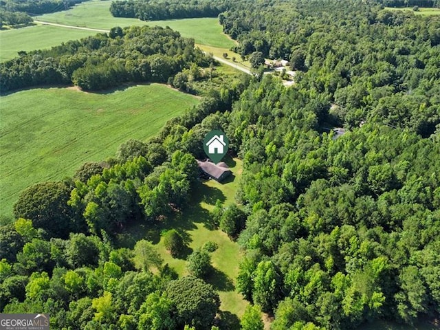 bird's eye view featuring a rural view and a wooded view