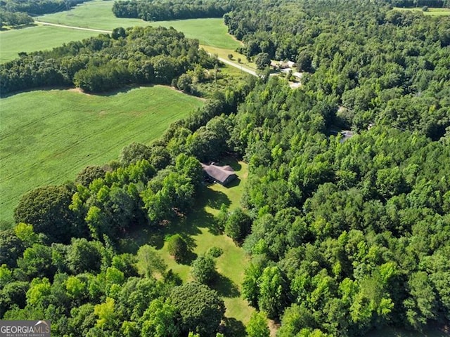 aerial view with a forest view and a rural view