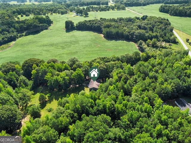 birds eye view of property featuring a rural view and a forest view