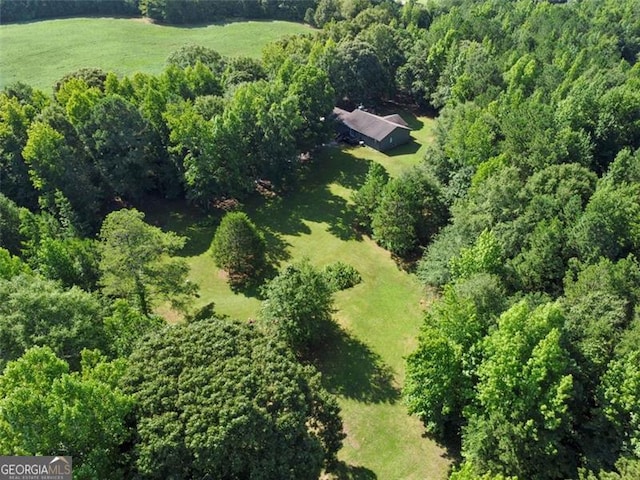 aerial view featuring a wooded view