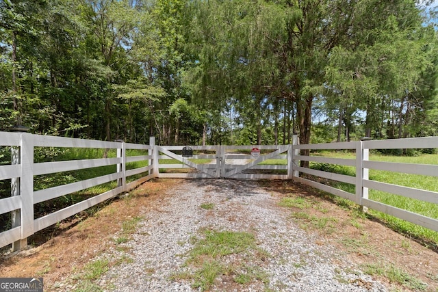 view of gate featuring fence