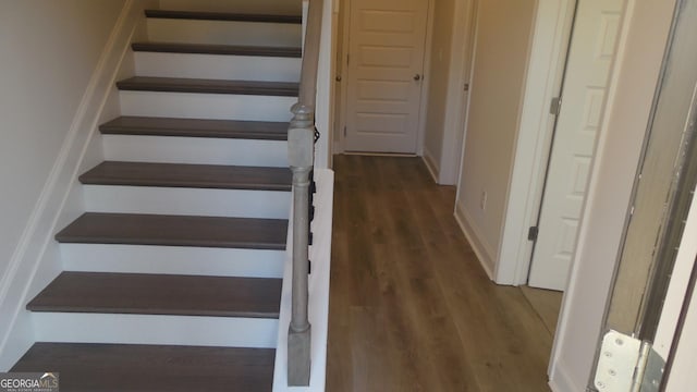 staircase featuring hardwood / wood-style floors