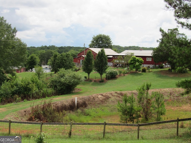 view of yard with a rural view