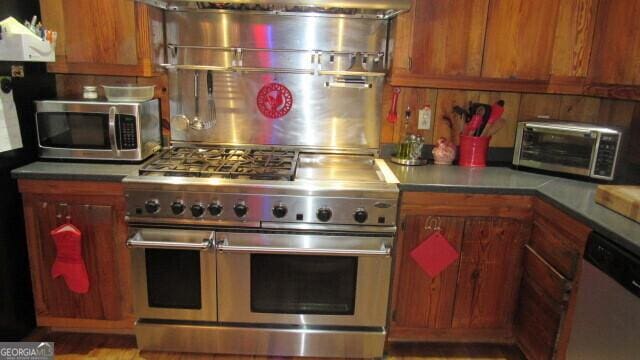 2296 Athens Rd, Royston, GA 30662 - kitchen featuring stainless steel appliances, a toaster, and brown cabinets