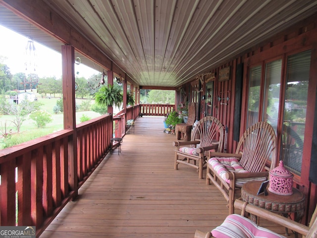 wooden terrace featuring a porch