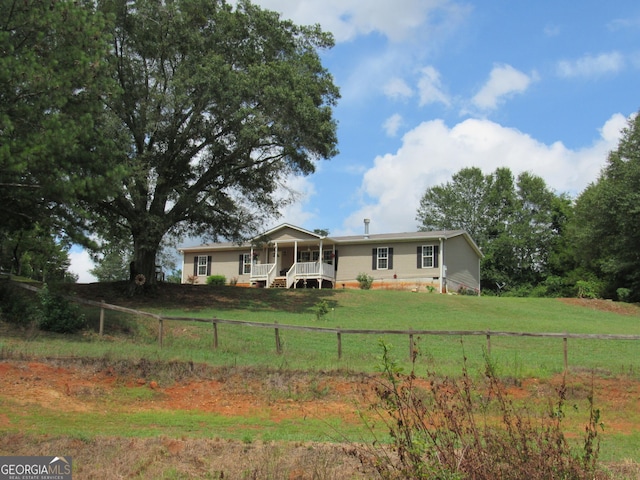 2296 Athens Rd, Royston, GA 30662 - manufactured / mobile home with crawl space, a front yard, fence private yard, and covered porch